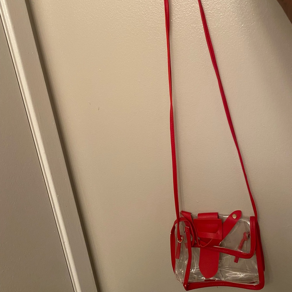 A mini red clear crossbody bag